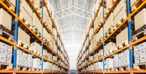 "Rows of shelves with boxes in modern warehouse Premium Photo"